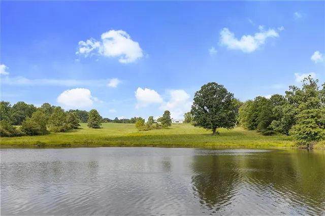 a view of a house with backyard and entertaining space