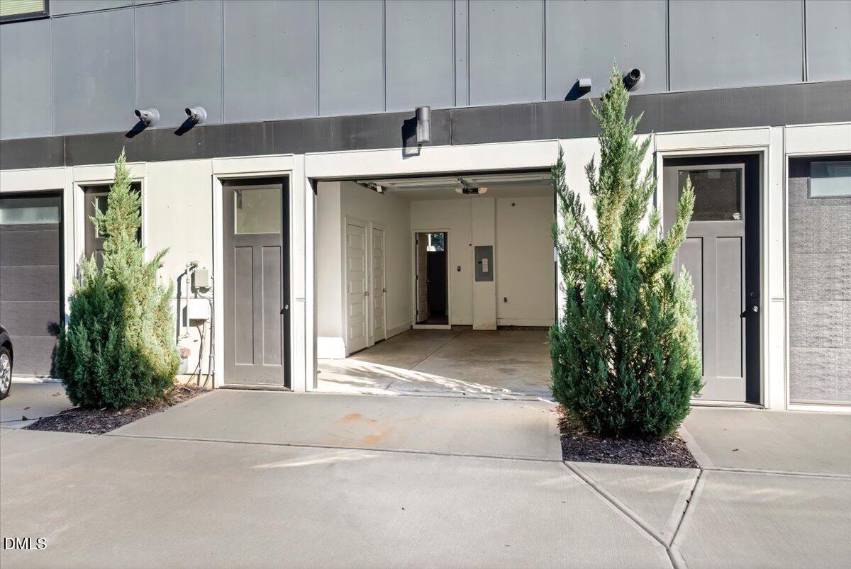 712 East Edenton Street, Unit 102 Raleigh, NC 27601 - Photo 15 of 17 a view of a house with potted plants