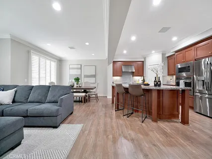 a living room kitchen with furniture and kitchen view