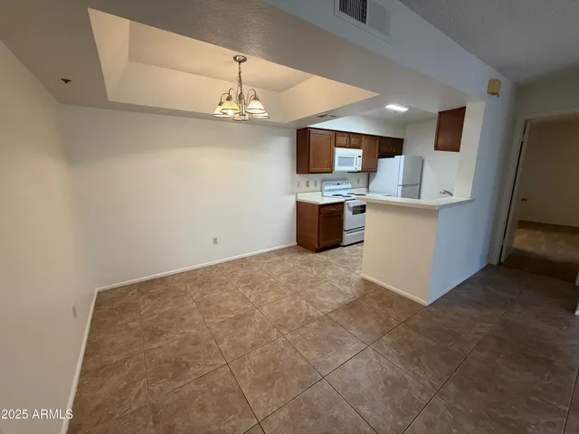 a view of a kitchen with a sink