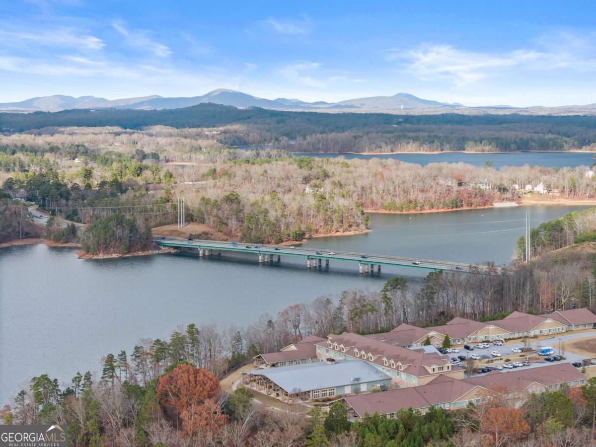 2486 Hidden Cove Court Gainesville, GA 30501 - Photo 11 of 13 a view of a lake with mountains in the background