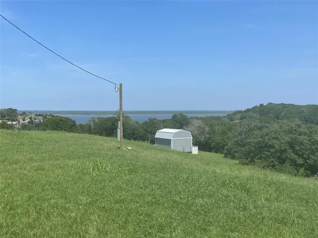 a view of a tiny house with a yard