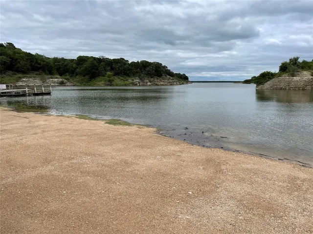 a view of a lake with houses in the background