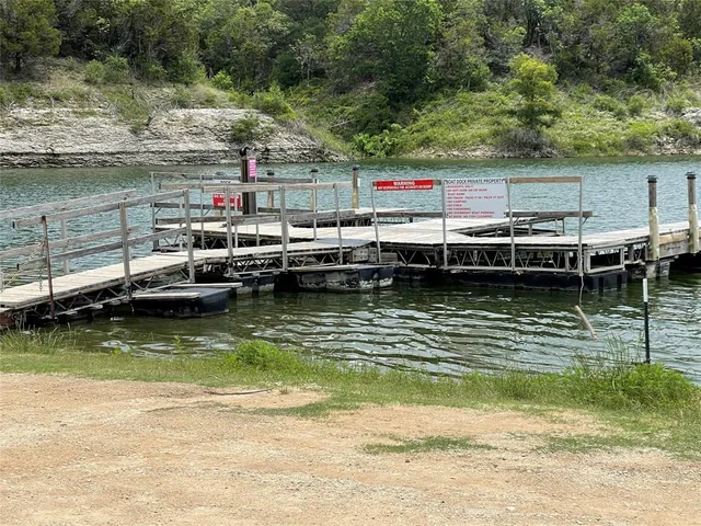 a view of swimming pool with outdoor seating and yard