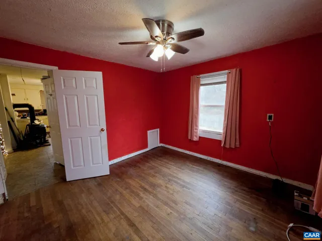 a view of livingroom with hardwood floor and ceiling fan