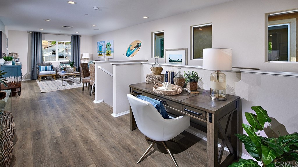 5617 Solstice Way Bonsall, CA 92003 - Photo 4 of 8 a kitchen with stainless steel appliances a table and chairs in it