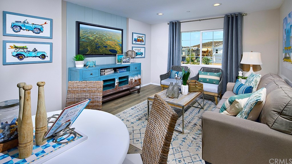 5617 Solstice Way Bonsall, CA 92003 - Photo 5 of 8 a living room with furniture and a flat screen tv