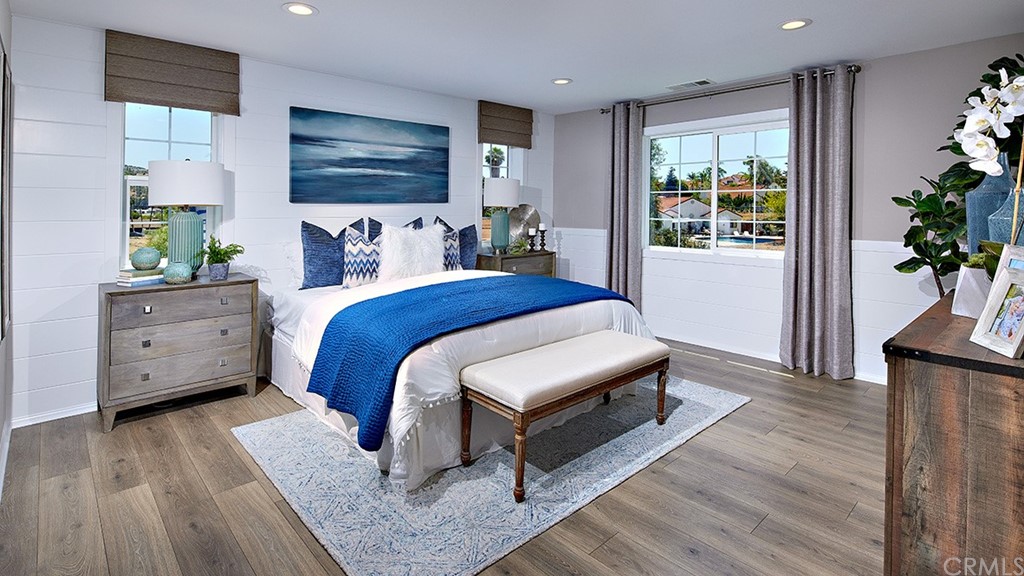 5617 Solstice Way Bonsall, CA 92003 - Photo 6 of 8 a bedroom with furniture and a potted plant