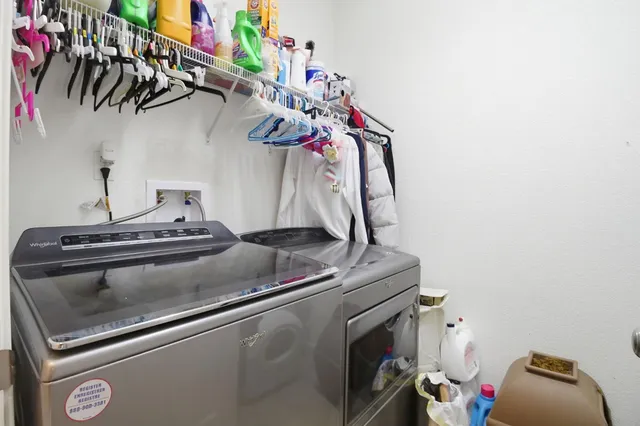 a utility room with dryer and washer
