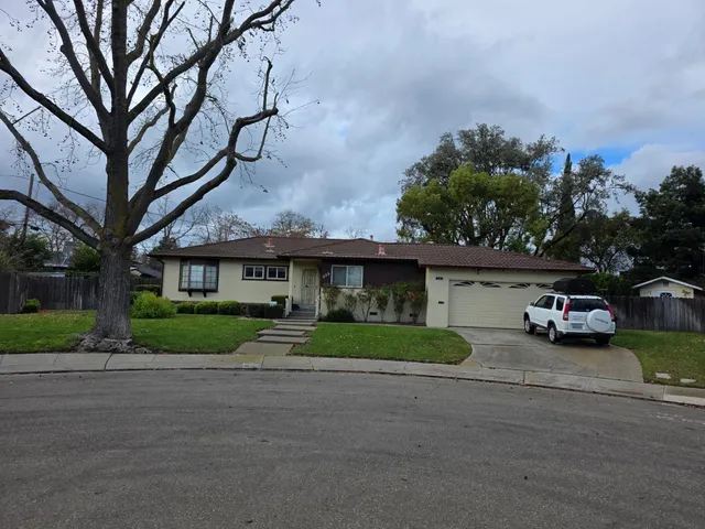 a view of street with parked cars