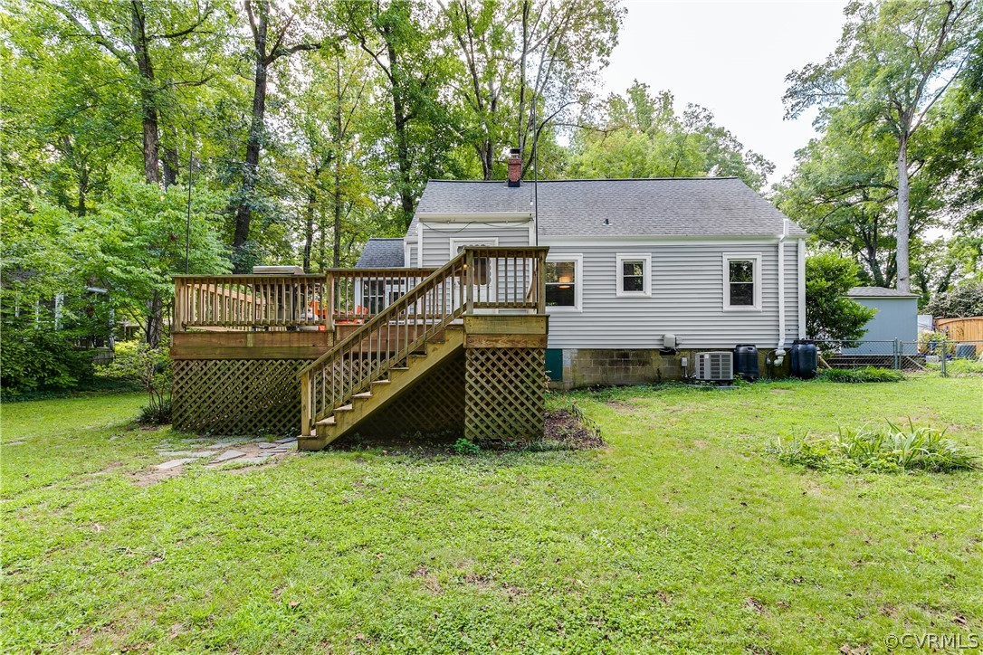 8934 Elm Road Richmond, VA 23235 - Photo 34 of 37 a view of a house with a backyard