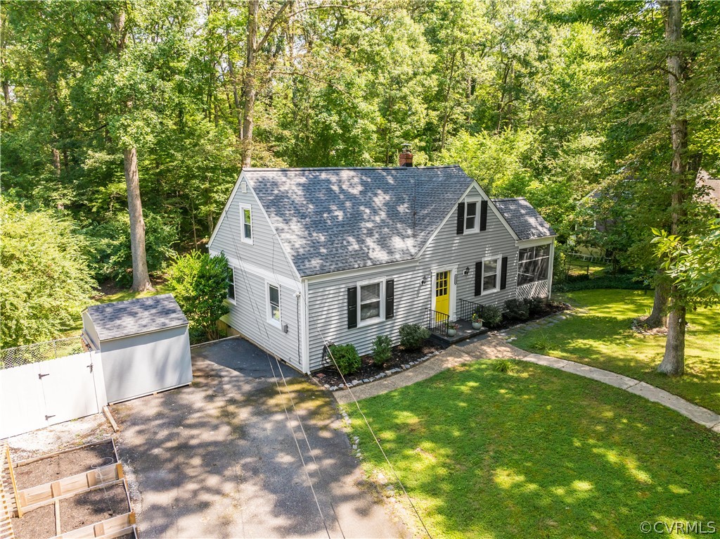 8934 Elm Road Richmond, VA 23235 - Photo 35 of 37 a front view of a house with garden