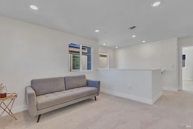 a living room with furniture and a couch