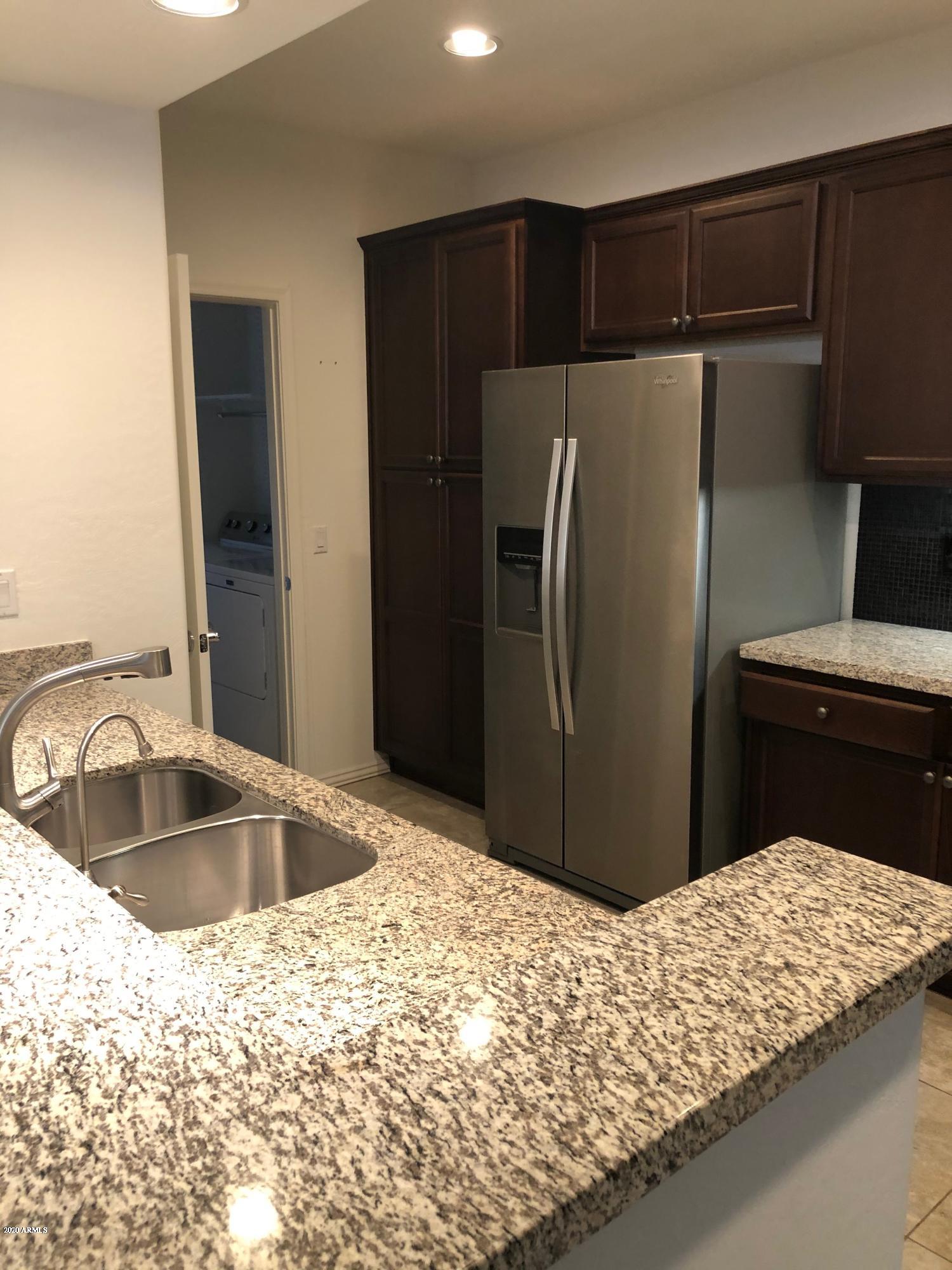 3935 East Rough Rider Road, Unit 1318 Phoenix, AZ 85050 - Photo 9 of 20 RRkitchen2