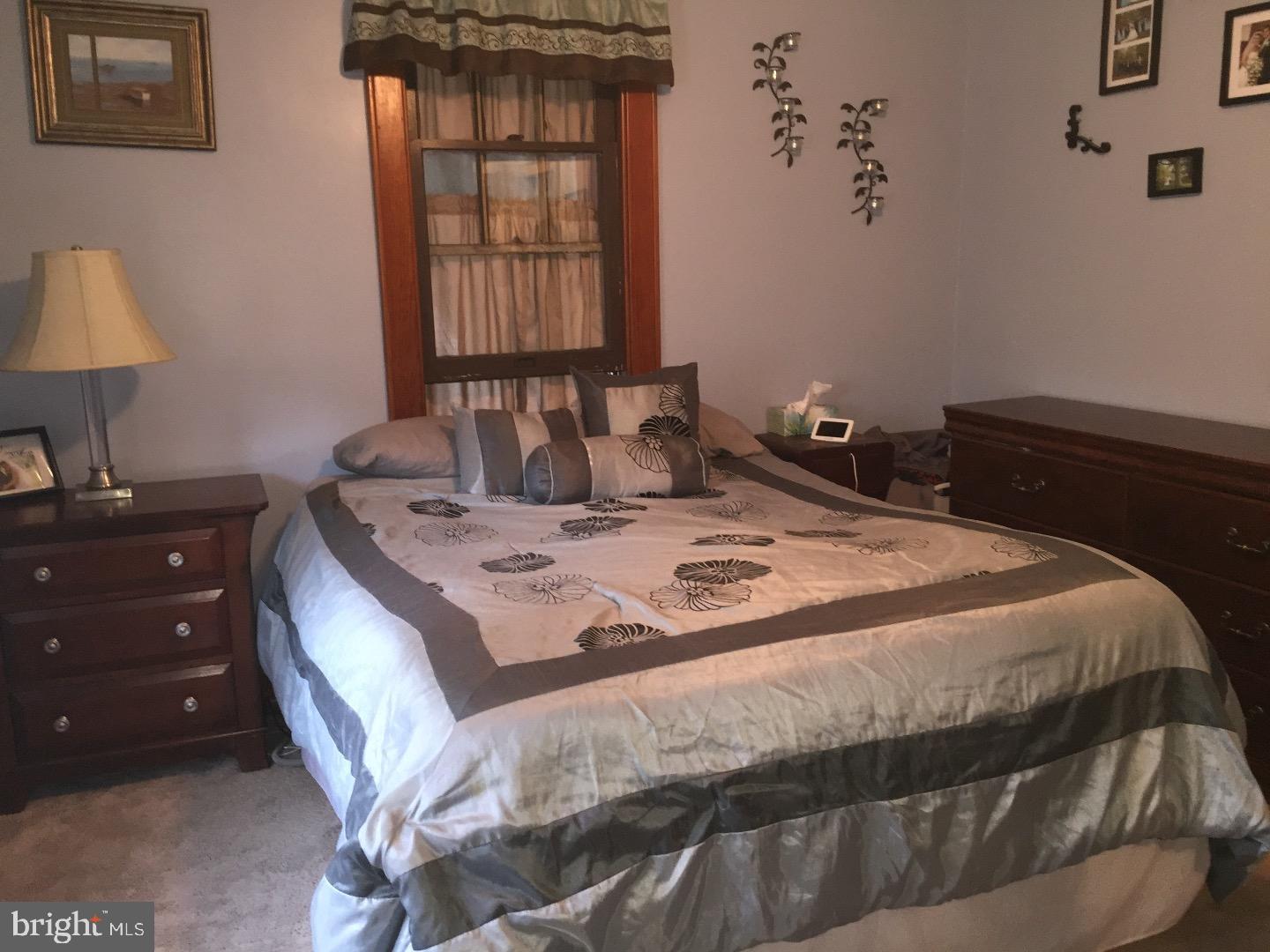 143 Barry Road Ashland, PA 17921 - Photo 17 of 21 a bedroom with a bed and a window