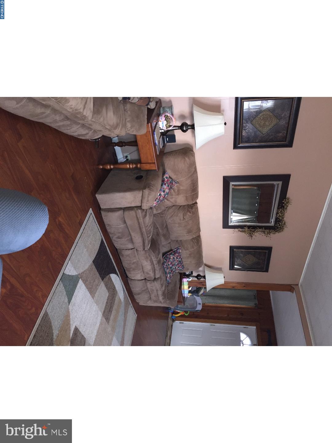 143 Barry Road Ashland, PA 17921 - Photo 6 of 21 a living room with furniture and a flat screen tv
