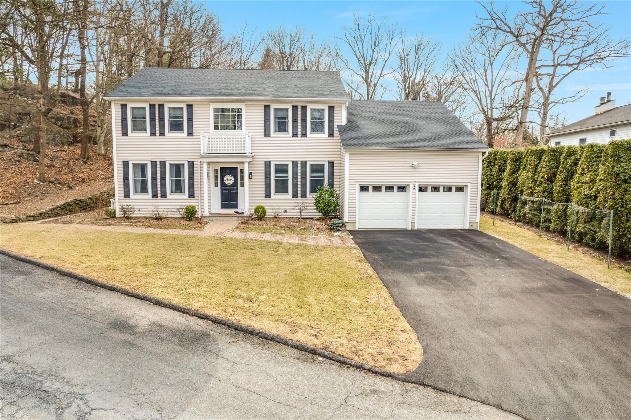3 Shady Road Ardsley, NY 10502 - Photo 1 of 1 a front view of a house with a yard and garage