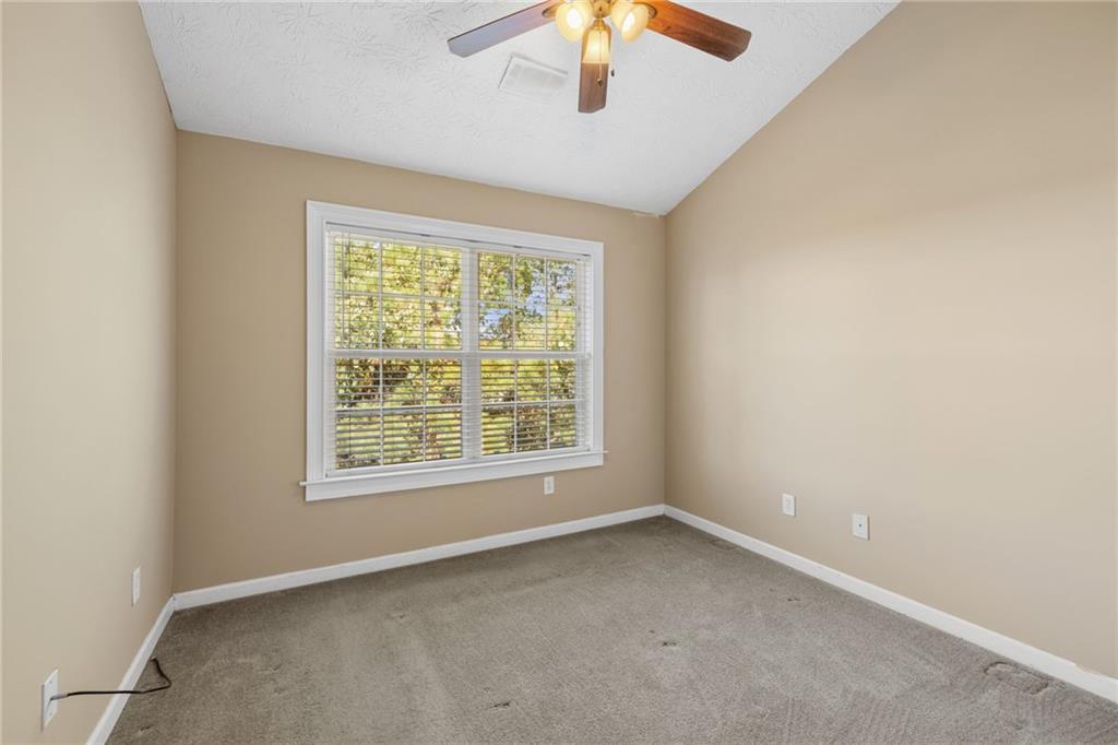 1558 Paramount View Trace Northeast Sugar Hill, GA 30518 - Photo 16 of 21 an empty room with a window