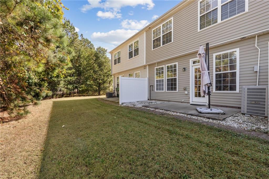1558 Paramount View Trace Northeast Sugar Hill, GA 30518 - Photo 21 of 21 a backyard of a house with lots of green space