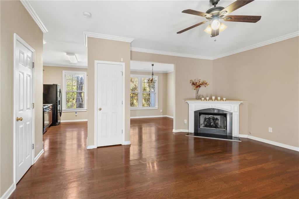 1558 Paramount View Trace Northeast Sugar Hill, GA 30518 - Photo 3 of 21 a view of a livingroom with a fireplace wooden floor and a window