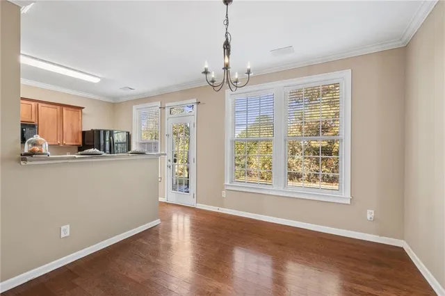 a view of a kitchen with an empty space and a window