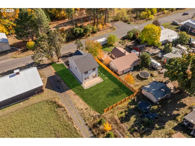 an aerial view of a house with a garden