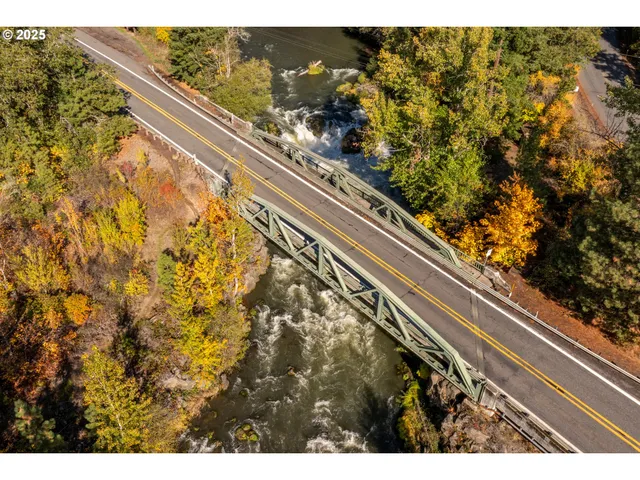a view of a swimming pool with a yard