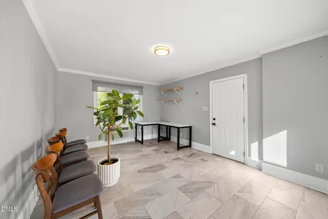 a bathroom with a granite countertop sink a toilet a mirror and shower
