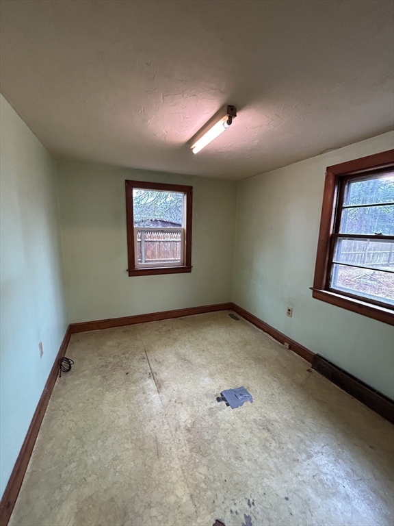 58 Cohasset Road Wareham, MA 02532 - Photo 9 of 14 an empty room with windows