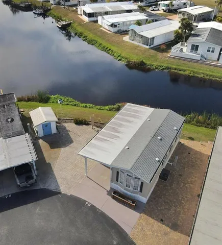 an aerial view of a house with a swimming pool