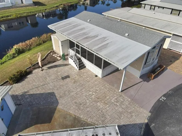 a terrace with wooden table and chairs