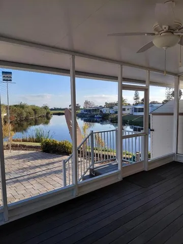 a view of a balcony with chairs