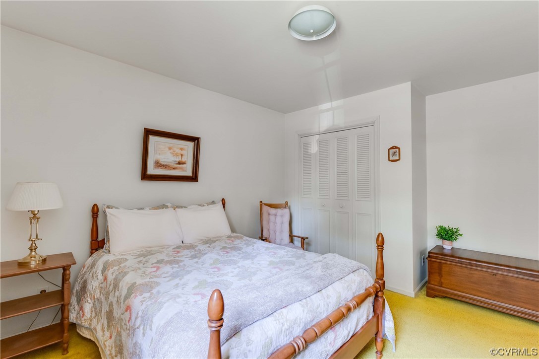 3620 Hemlock Road Chester, VA 23831 - Photo 26 of 35 a bedroom with a bed and a lamp on table