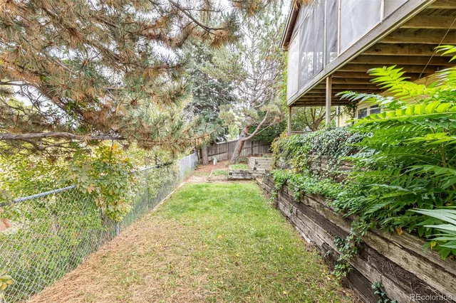 a pathway of a house with a yard