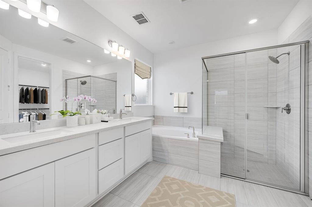 526 Chatham Street Oak Point, TX 75068 - Photo 11 of 35 a bathroom with a double vanity sink mirror and shower