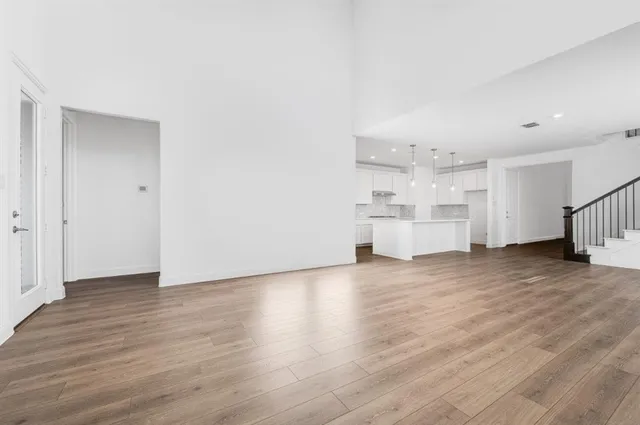 a view of a kitchen with a sink and a refrigerator