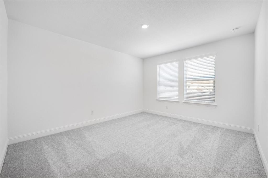 526 Chatham Street Oak Point, TX 75068 - Photo 16 of 35 an empty room with windows