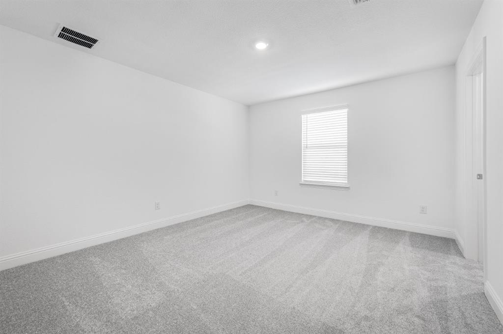 526 Chatham Street Oak Point, TX 75068 - Photo 17 of 35 an empty room with a window