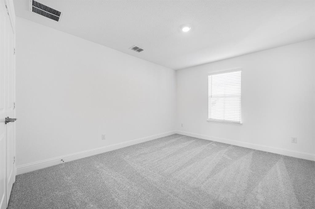 526 Chatham Street Oak Point, TX 75068 - Photo 18 of 35 an empty room with a window