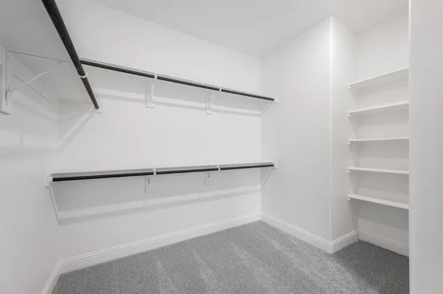 a view of an empty walk in closet