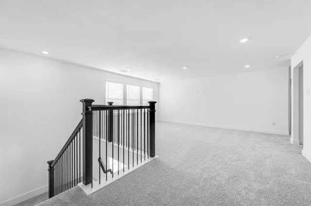 a view of a hallway with a window