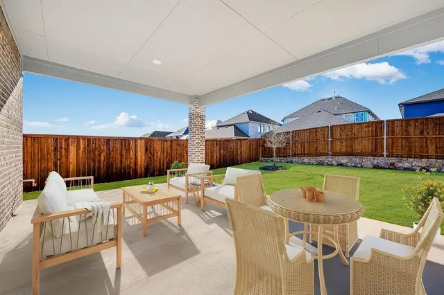 a view of a patio with a yard