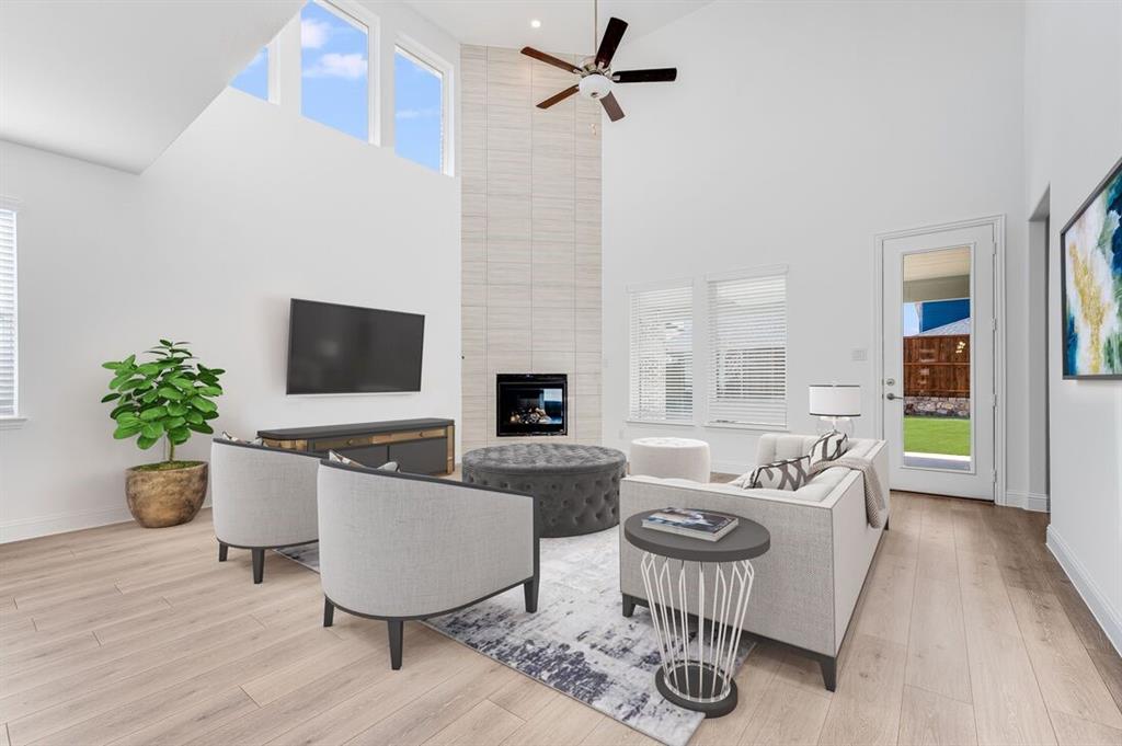526 Chatham Street Oak Point, TX 75068 - Photo 3 of 35 a living room with furniture potted plant and a flat screen tv