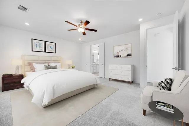 a spacious bedroom with a bed and a chandelier