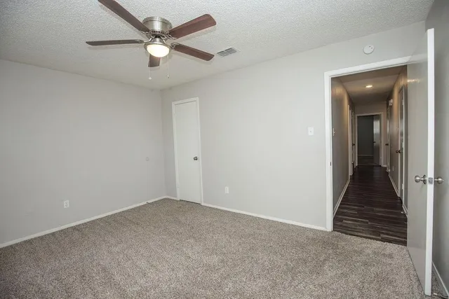 wooden floor in a hall with a window