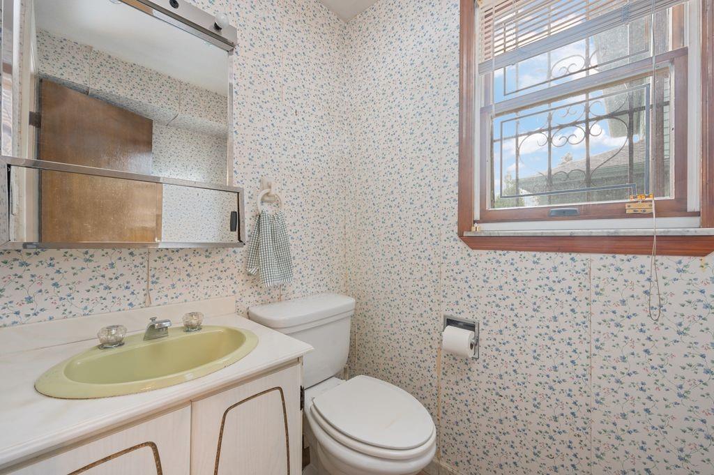 475 Argyle Road Brooklyn, NY 11218 - Photo 13 of 35 a bathroom with a sink a toilet and a mirror