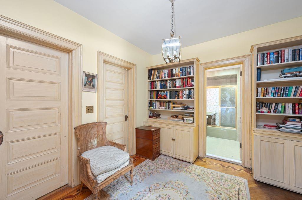 475 Argyle Road Brooklyn, NY 11218 - Photo 16 of 35 a living room with furniture and a book shelf