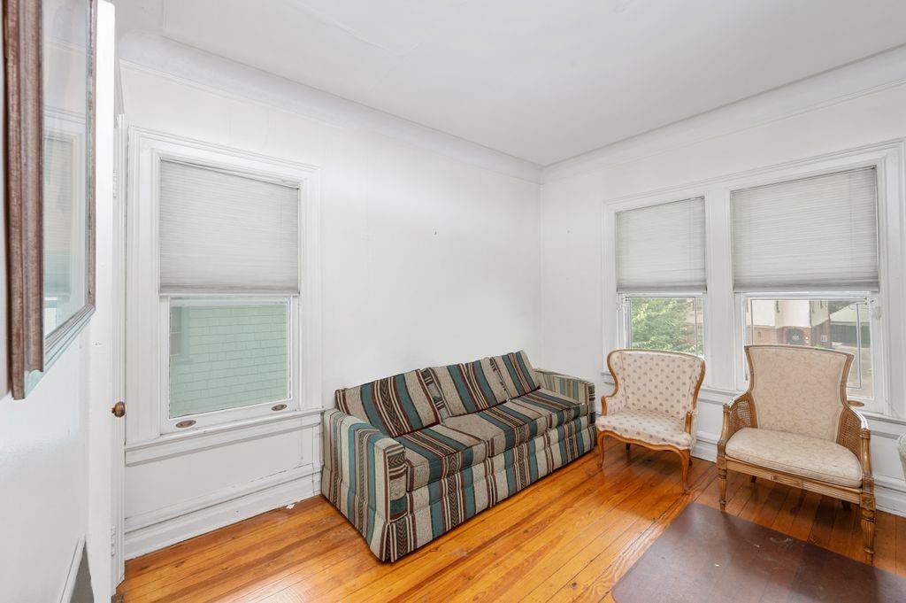 475 Argyle Road Brooklyn, NY 11218 - Photo 21 of 35 a living room with furniture and a window