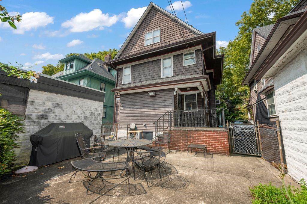 475 Argyle Road Brooklyn, NY 11218 - Photo 28 of 35 a backyard of a house with fire pit and outdoor seating