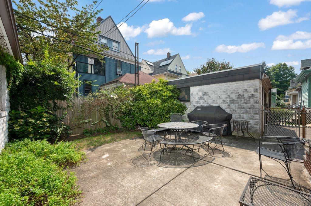 475 Argyle Road Brooklyn, NY 11218 - Photo 29 of 35 a view of a patio with table and chairs and potted plants